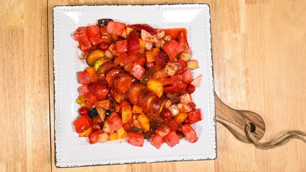 Tostilocos fruit plate with chamoy and tajín
